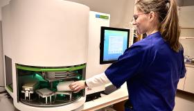 Person operating biobank analyzes instrument